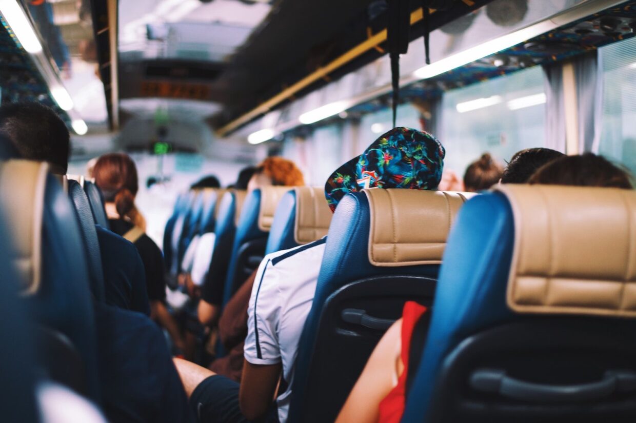 selective focus photography of people on bus